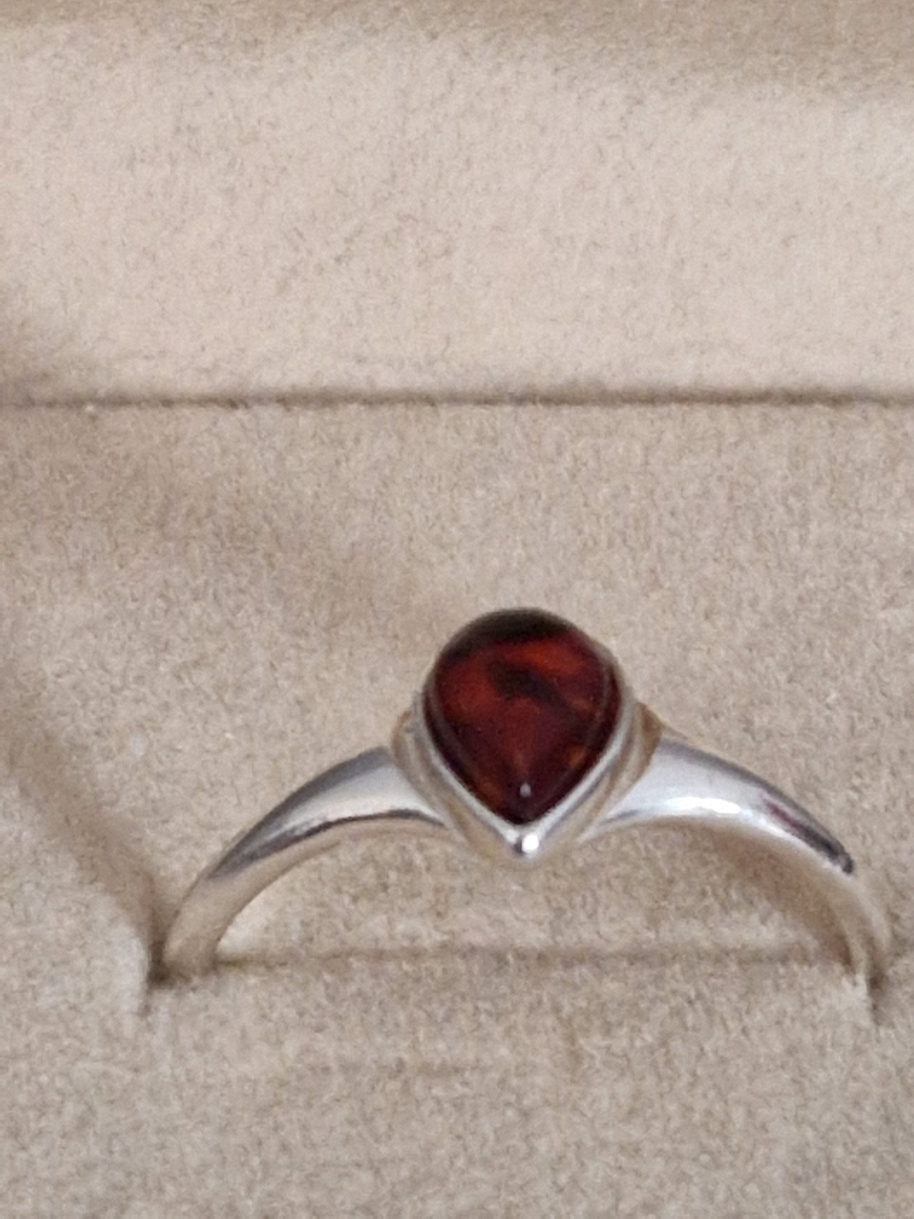 A Beautiful 925 Hallmarked Silver Ring. With a Amber insert. Size Q.