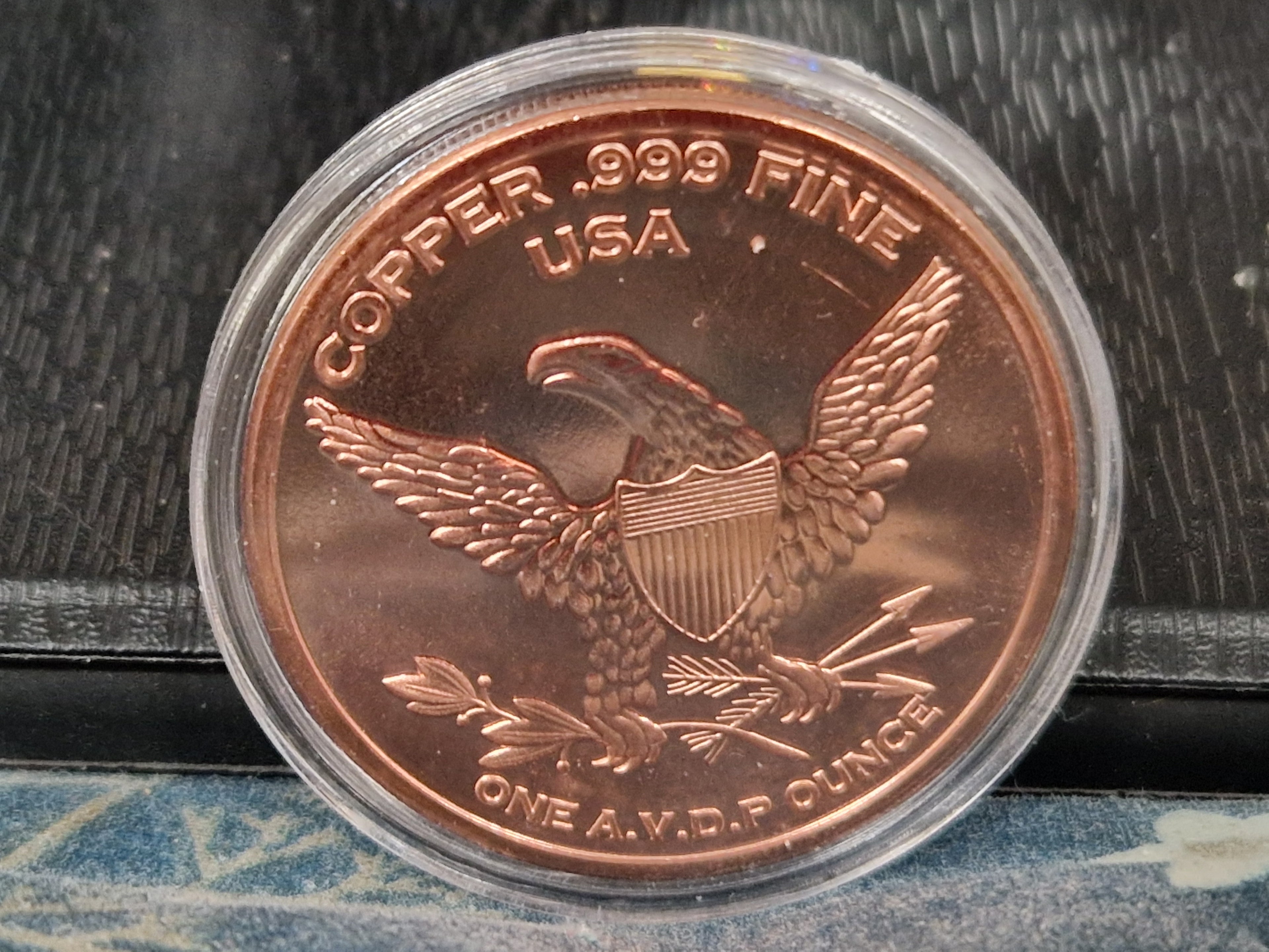 A 1/1000th of 24ct Gold.  1 grain of fine silver. & 1oz of Pure Copper.