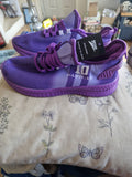 A Brandnew purple pair of size 42/ UK 7.5 Trainers.