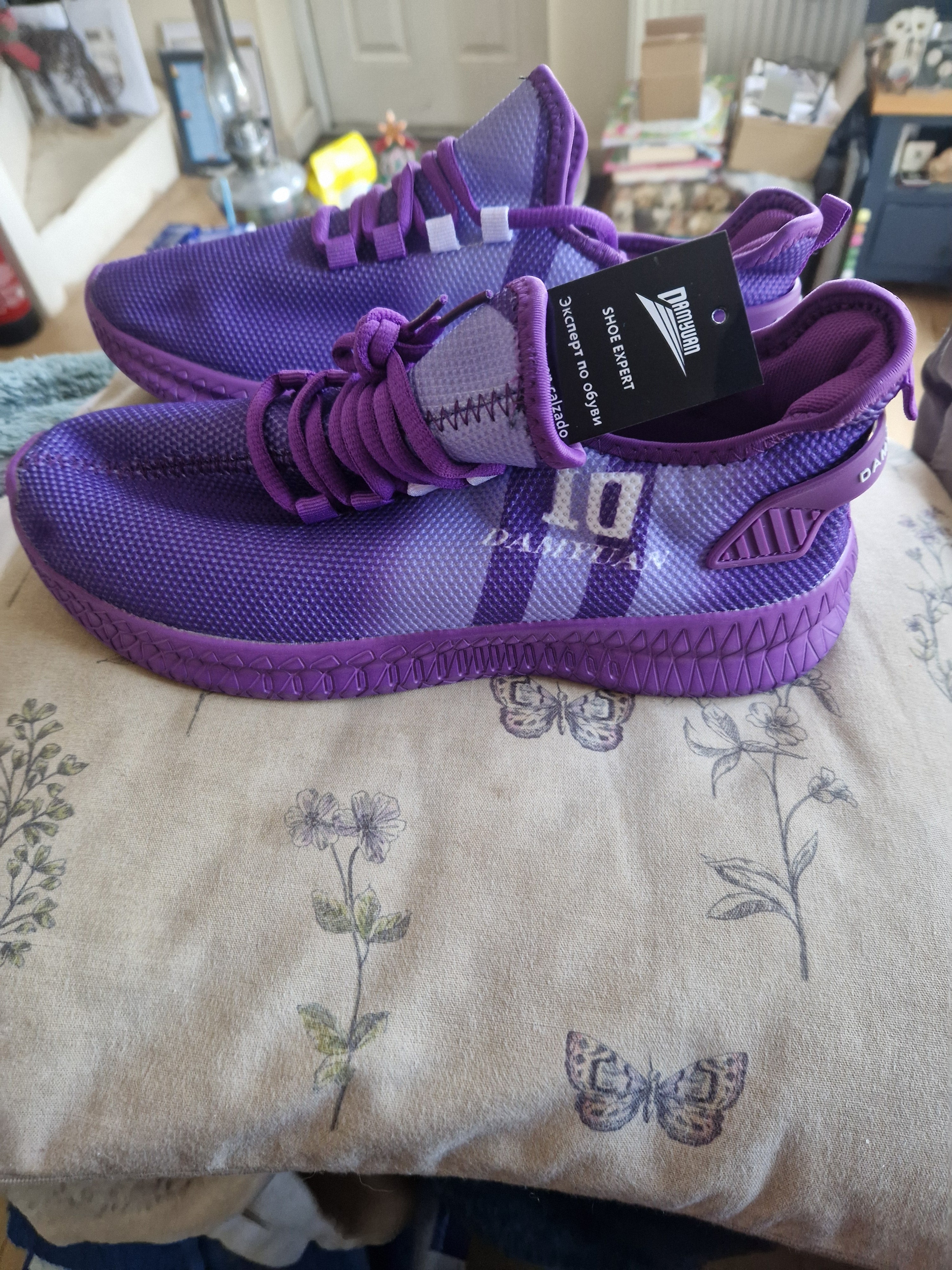 A Brandnew purple pair of size 42/ UK 7.5 Trainers.