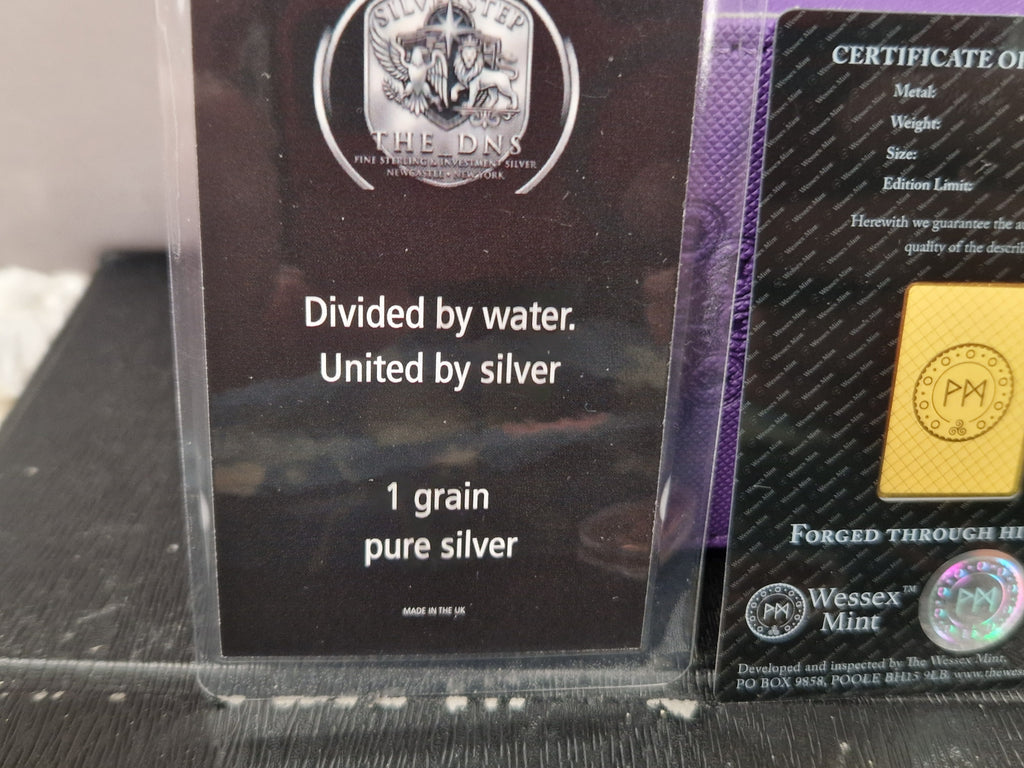 A 1/1000th of 24ct Gold.  1 grain of fine silver. & 1oz of Pure Copper.