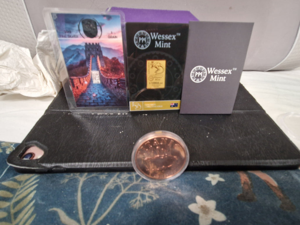 A 1/1000th of 24ct Gold.  1 grain of fine silver. & 1oz of Pure Copper.