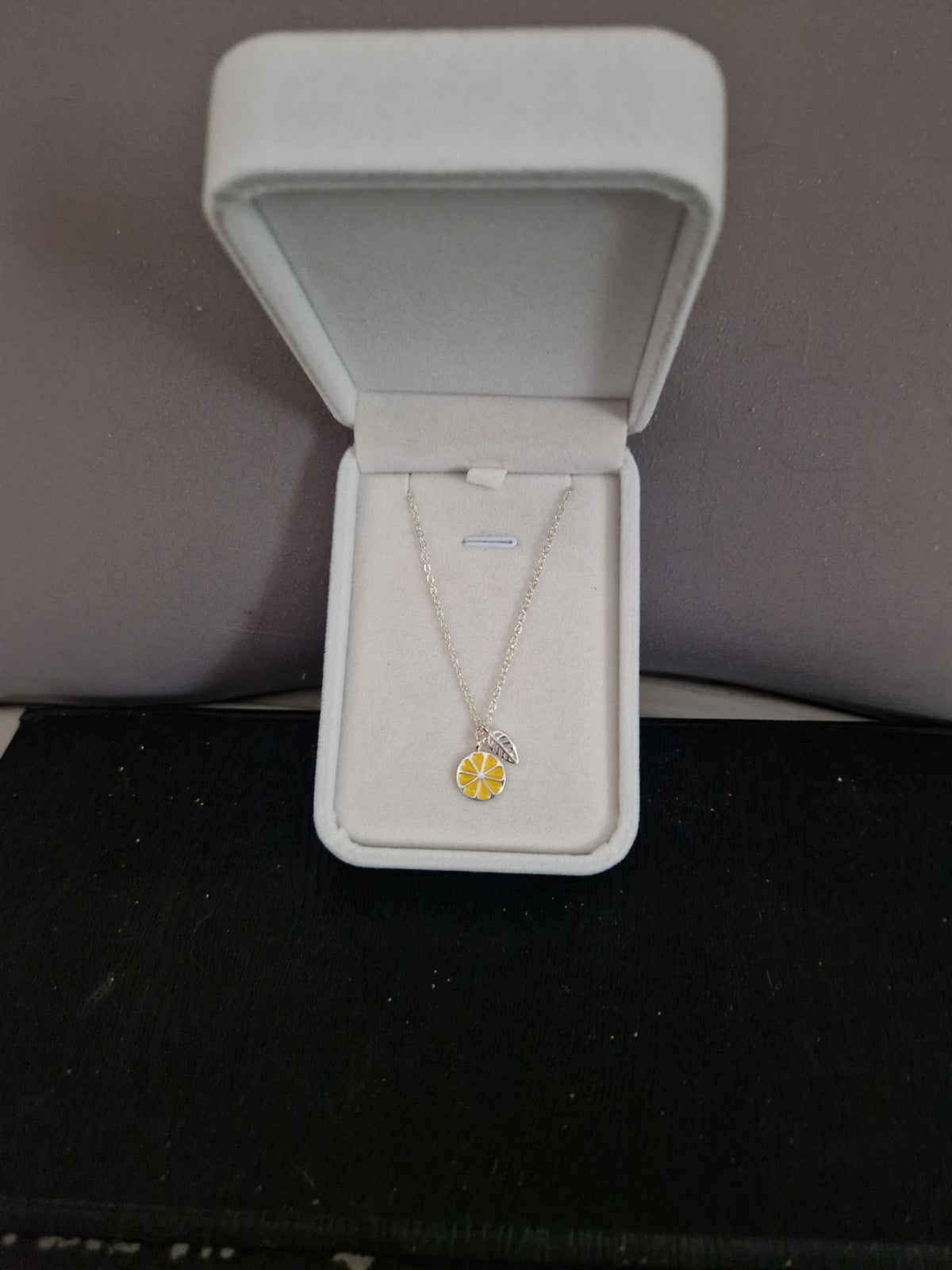 A Beautiful Slice of Lemon with leaf. Hallmarked Silver Necklace. 18 inches.